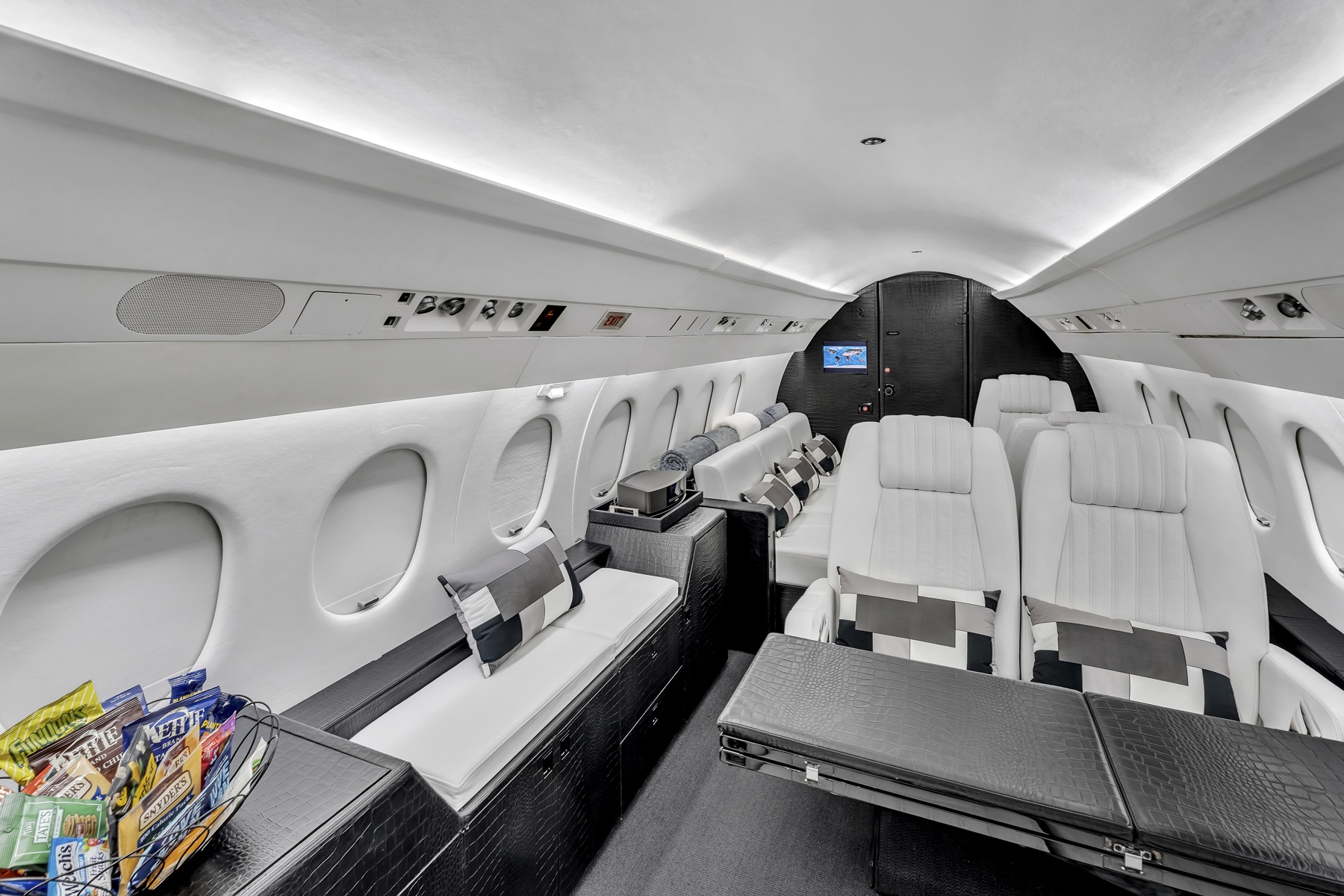 Falcon 900 club seating, conference table, and lounge viewed from the forward cabin