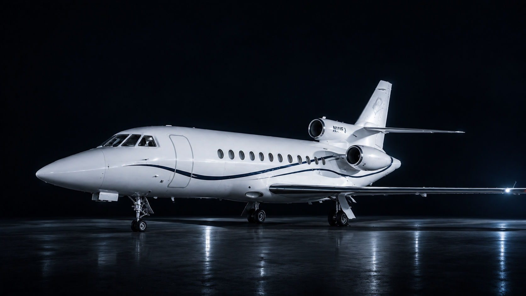 Cinematic runway portrait of Sonic Flights’ white and navy Falcon 900